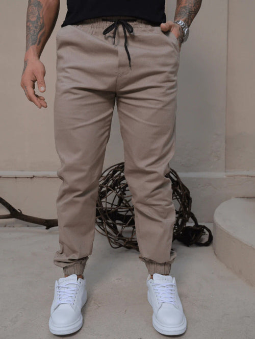 Calça Jogger Masculina, jeans sarja, confortável, estilosa, streetwear, look casual, cintura com cordão, bolso funcional, alta elasticidade, disponível em preta, caqui, gelo, jeans, pronta entrega, nota fiscal