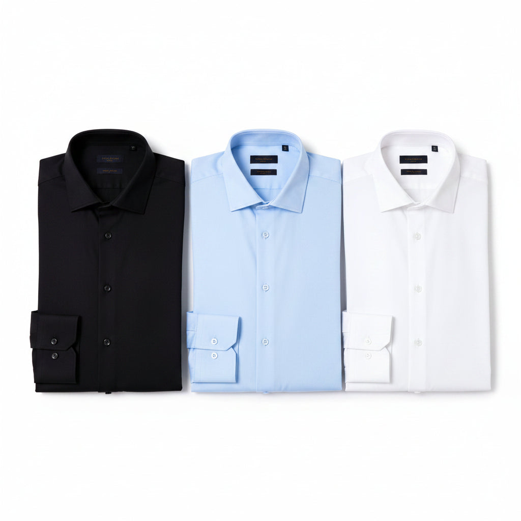 Kit com 3 Camisas Sociais Masculinas Plus Size nas cores preto, branco e azul bebê. Modelagem confortável, manga longa, sem bolso frontal, tecido premium e excelente caimento para trabalho, eventos e uso diário.