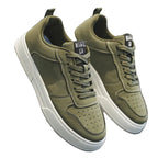 Tênis casual masculino com zíper lateral, couro sintético e solado antiderrapante disponível em diversas cores.