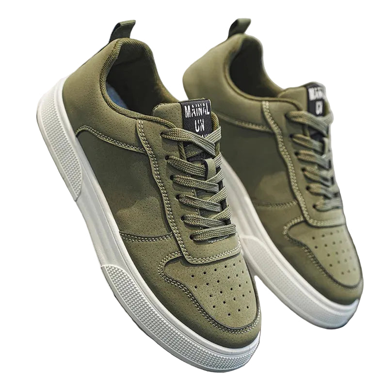 Tênis casual masculino com zíper lateral, couro sintético e solado antiderrapante disponível em diversas cores.