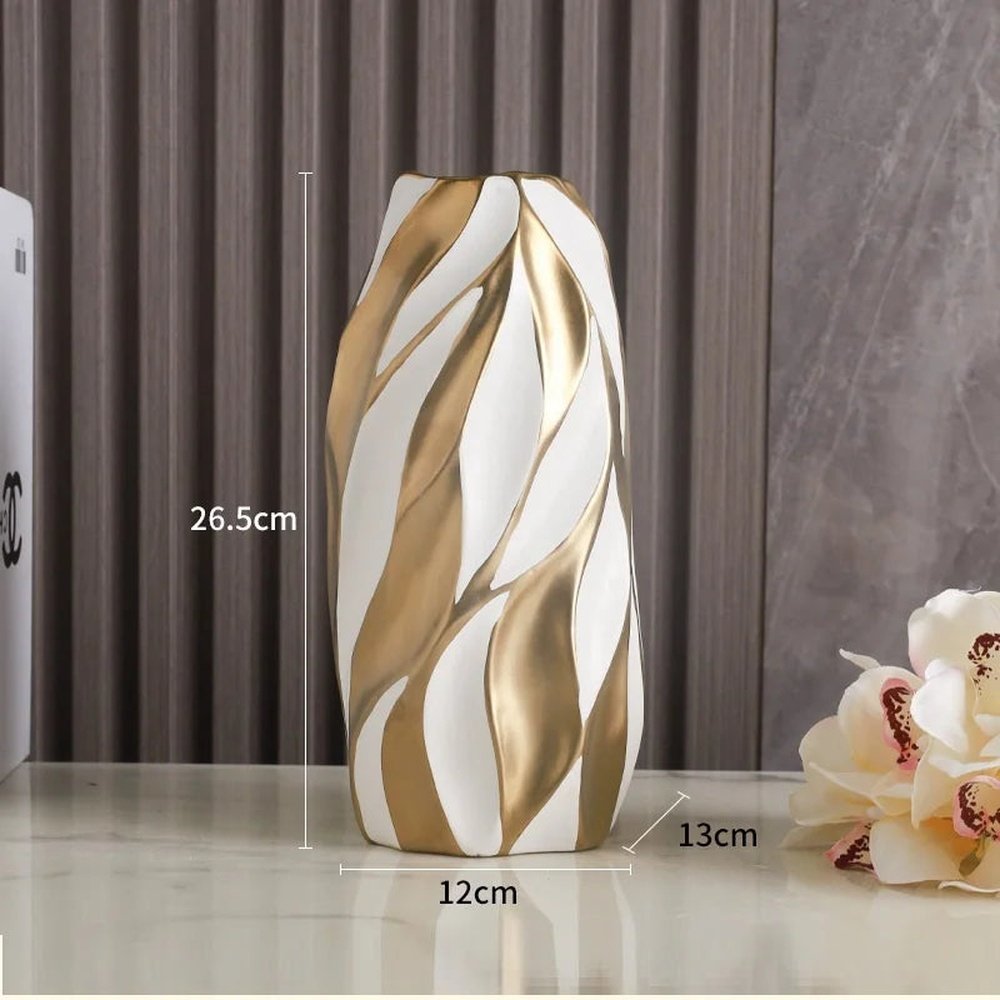 Vaso decorativo de cerâmica Elegance, combina design sofisticado com acabamento refinado, ideal para valorizar qualquer ambiente. Sua estrutura resistente e textura suave proporcionam durabilidade e um toque de requinte, tornando-o perfeito para exibir flores ou como peça decorativa independente. Um item versátil que eleva a estética do seu espaço com elegância e qualidade.