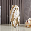 Vaso decorativo de cerâmica Elegance, combina design sofisticado com acabamento refinado, ideal para valorizar qualquer ambiente. Sua estrutura resistente e textura suave proporcionam durabilidade e um toque de requinte, tornando-o perfeito para exibir flores ou como peça decorativa independente. Um item versátil que eleva a estética do seu espaço com elegância e qualidade.